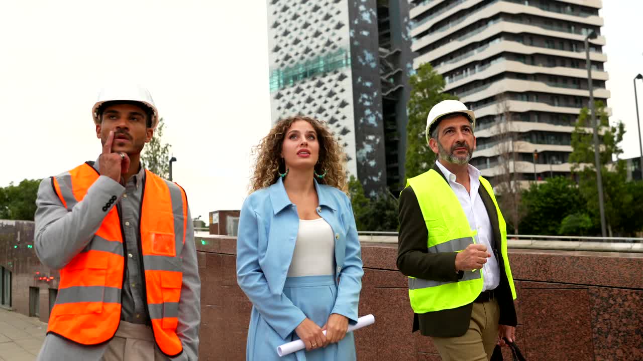 Construction Team Inspecting New Building