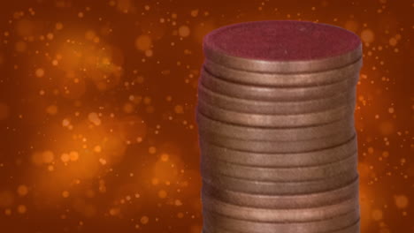 animación de puntos sobre una pila de monedas sobre un fondo naranja