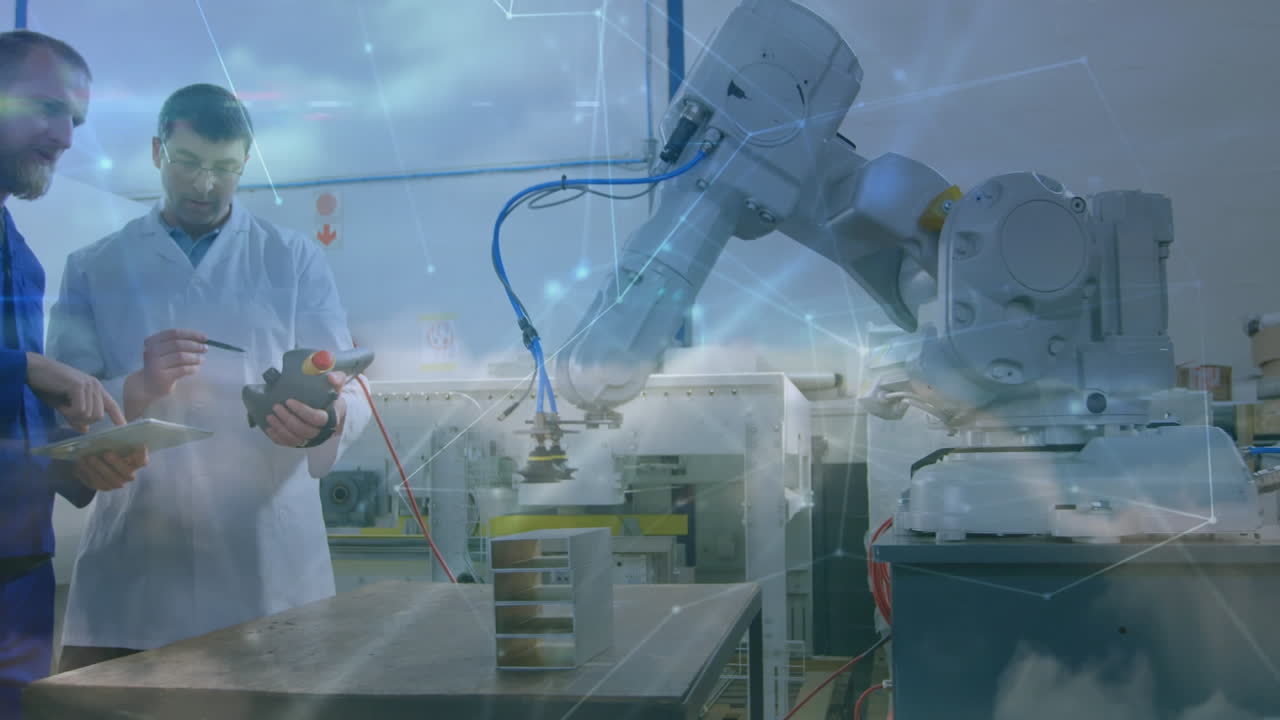 animazione della rete di connessioni su uomini caucasici che lavorano su robot