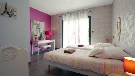 Modern-big-furnished-girls-bedroom-with-twin-beds-push-in-shot