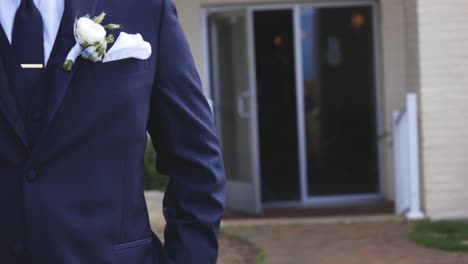 groom before ceremony begins outside