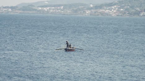 slow motion shot of a fisherman pulling in a fishing net