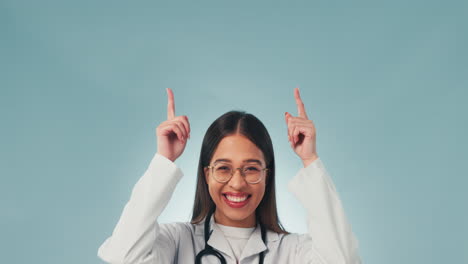 portrait, studio and woman in healthcare pointing