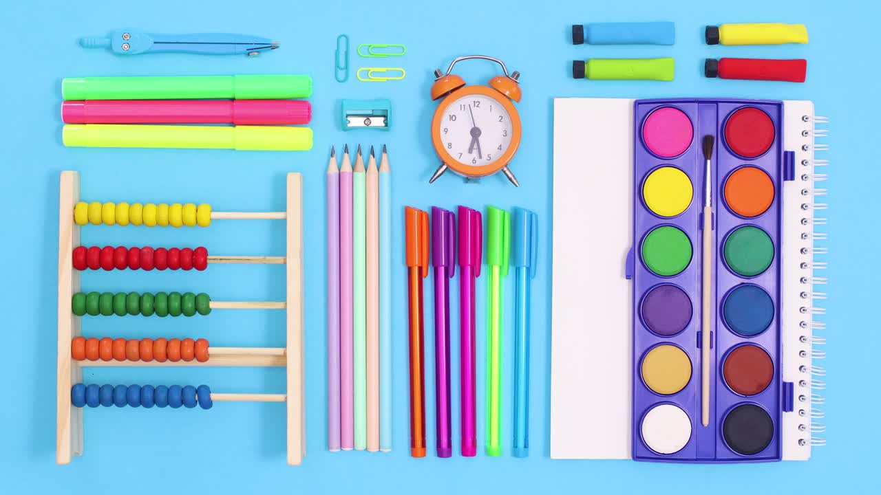 Creative back to school layout made of writing stationery move on blue theme. Stop motion