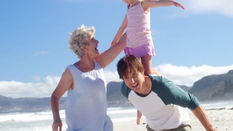 Multi-generation-family-enjoying-at-beach