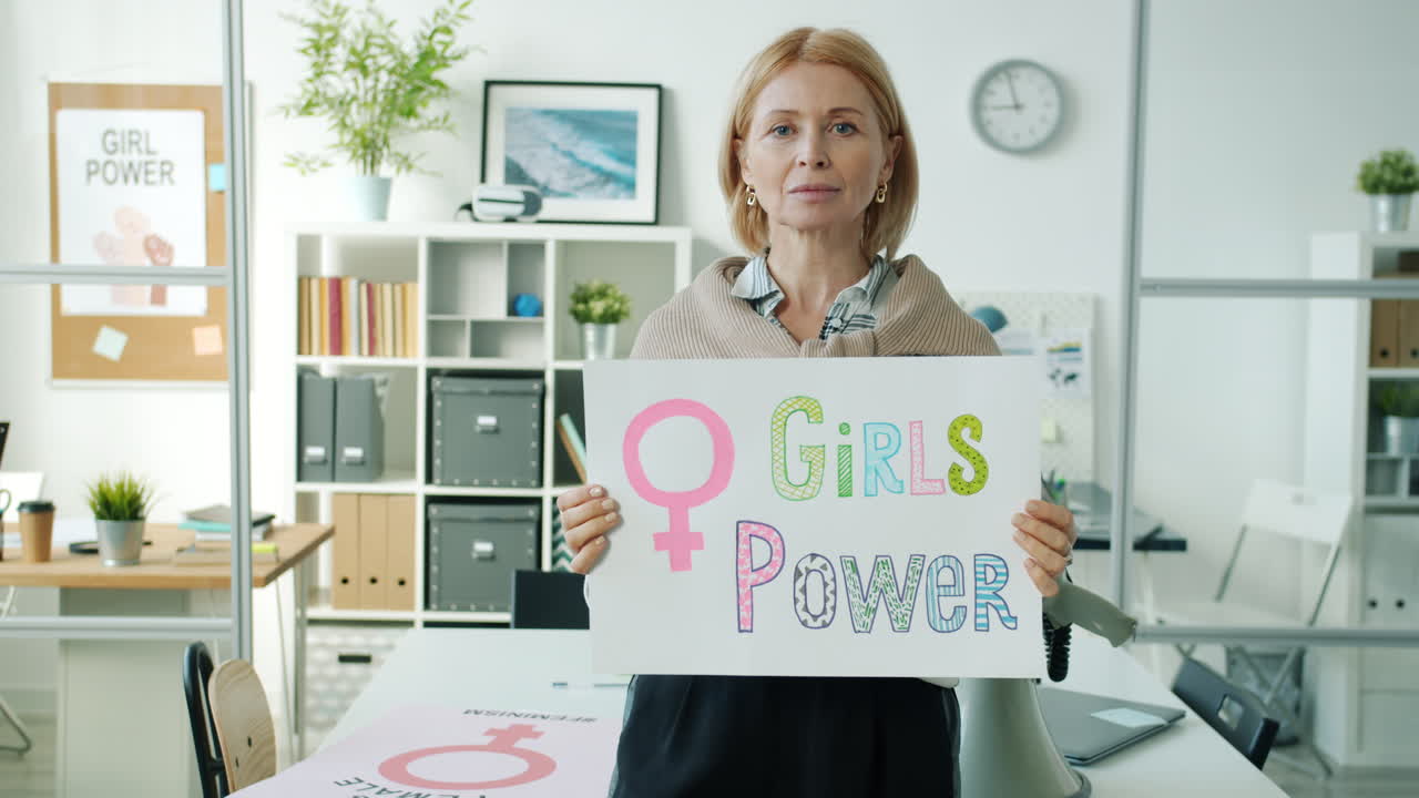 Woman Holding a 'Girls Power' Sign