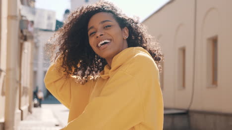 happy woman in yellow hoodie