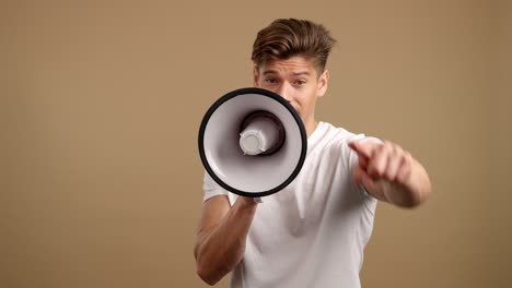 man with megaphone pointing at viewer