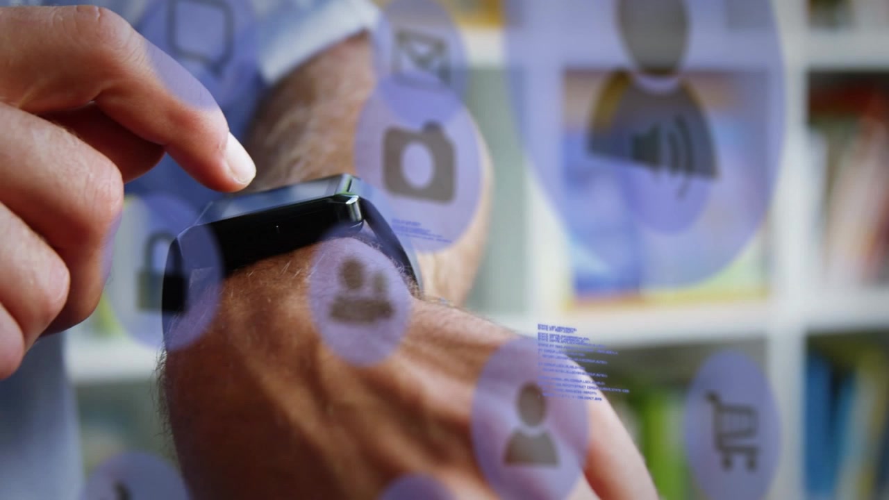 Animation of technology icons over caucasian man checking smartwatch