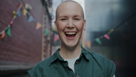 smiling bald woman in city