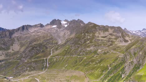 Aerial-Drone-flying-towards-Switzerland-Mountain-pass-road