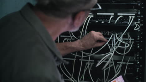 network technician working on server rack