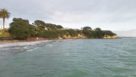 Low-cinematic-shot-of-the-stunning-New-Zealand-Coastline