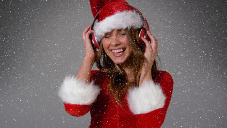 animation of smiling woman wearing santa costume over snow falling