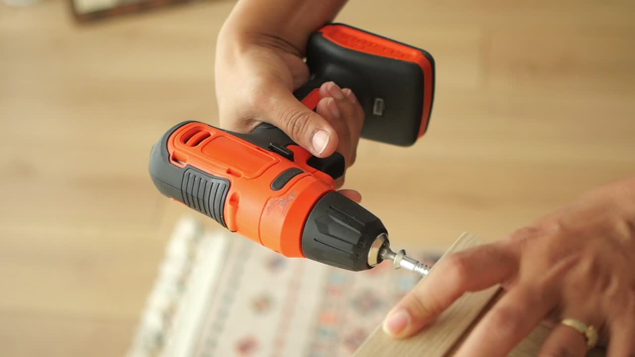 Using a Drill to Drive a Screw into Wood