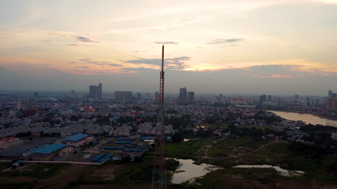 Sunset over the Mekong River and Phnom Penh Cityscape, aerial view