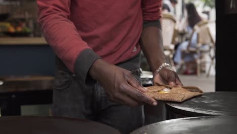 slow motion: final fresh galette on creperie in lovely paris, france