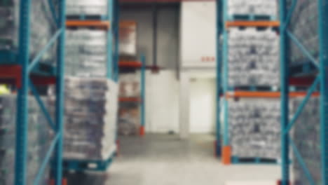 Warehouse,-blur-and-person-on-forklift