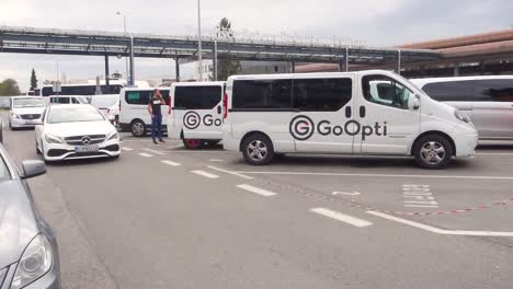 ljubljana international airport. taxi in front of airport terminal.
