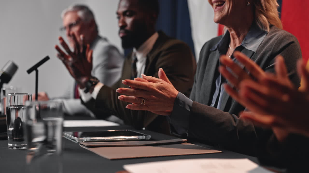 Politicians at a Conference Applauding