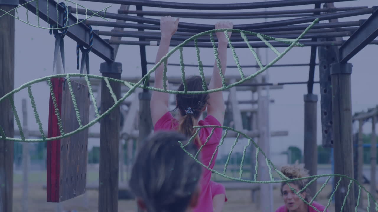 People in pink shirts navigating obstacle course with DNA strand animation overlay