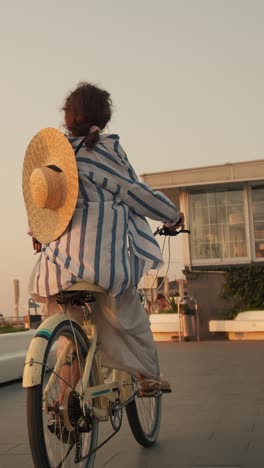 woman riding a bicycle on a city street