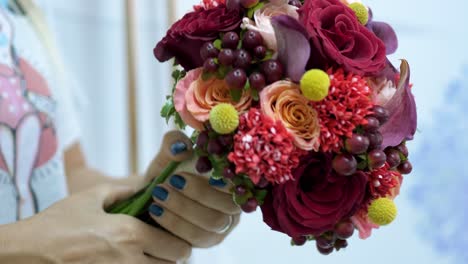 girl making bouquet of flowers in slow motion