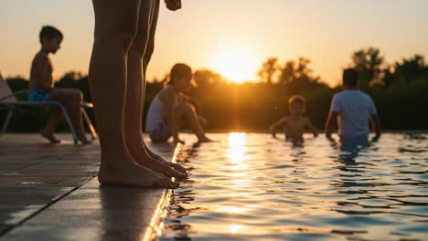 a joyful sunset scene by the poolside: children playing and enjoying a warm evening together as the sun sets over the calm water's surface