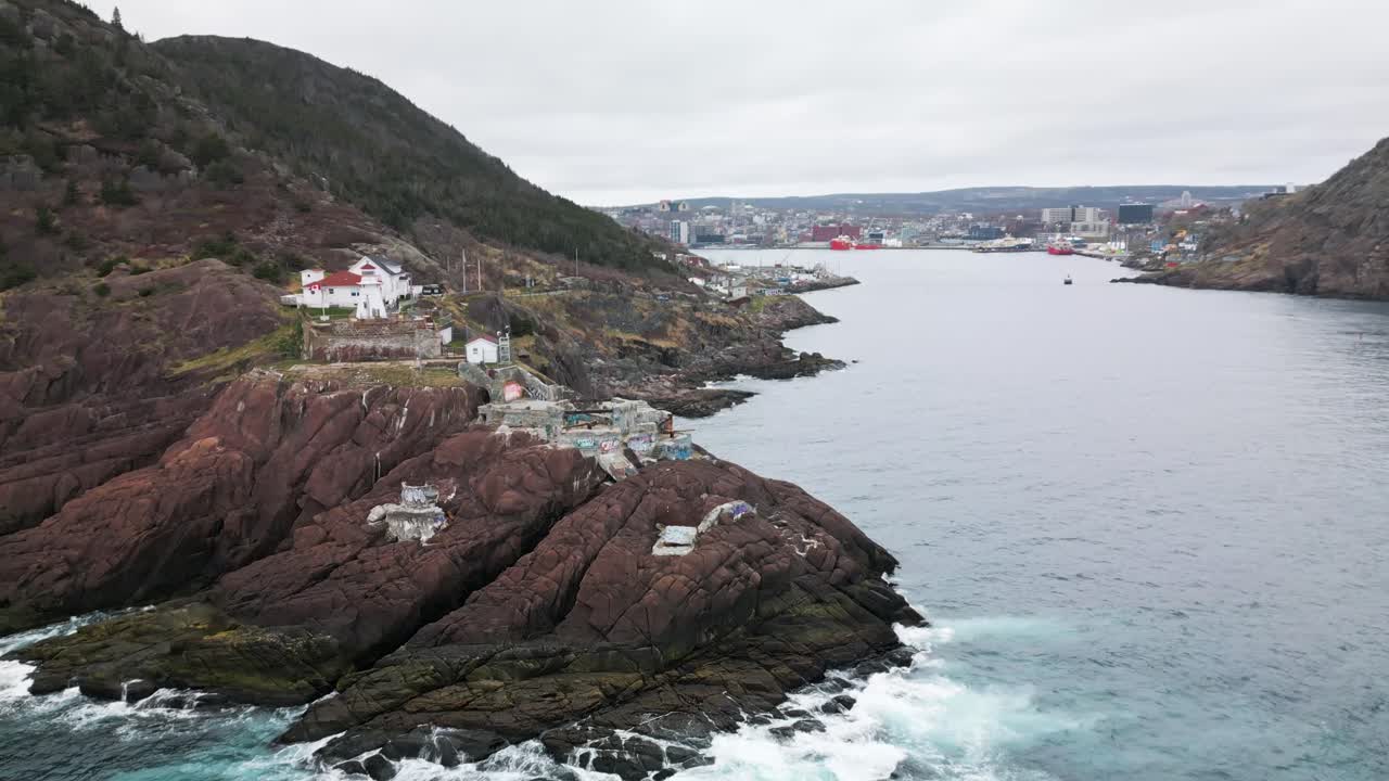 Drone shot of Fort Amherst in St John's, Newfoundland, Canada. Spinning around the point to reveal the coastline.