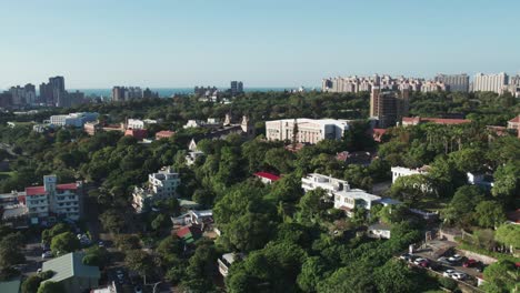 Aletheia-University-campus-in-Taipei-with-surrounding-greenery,-Aerial