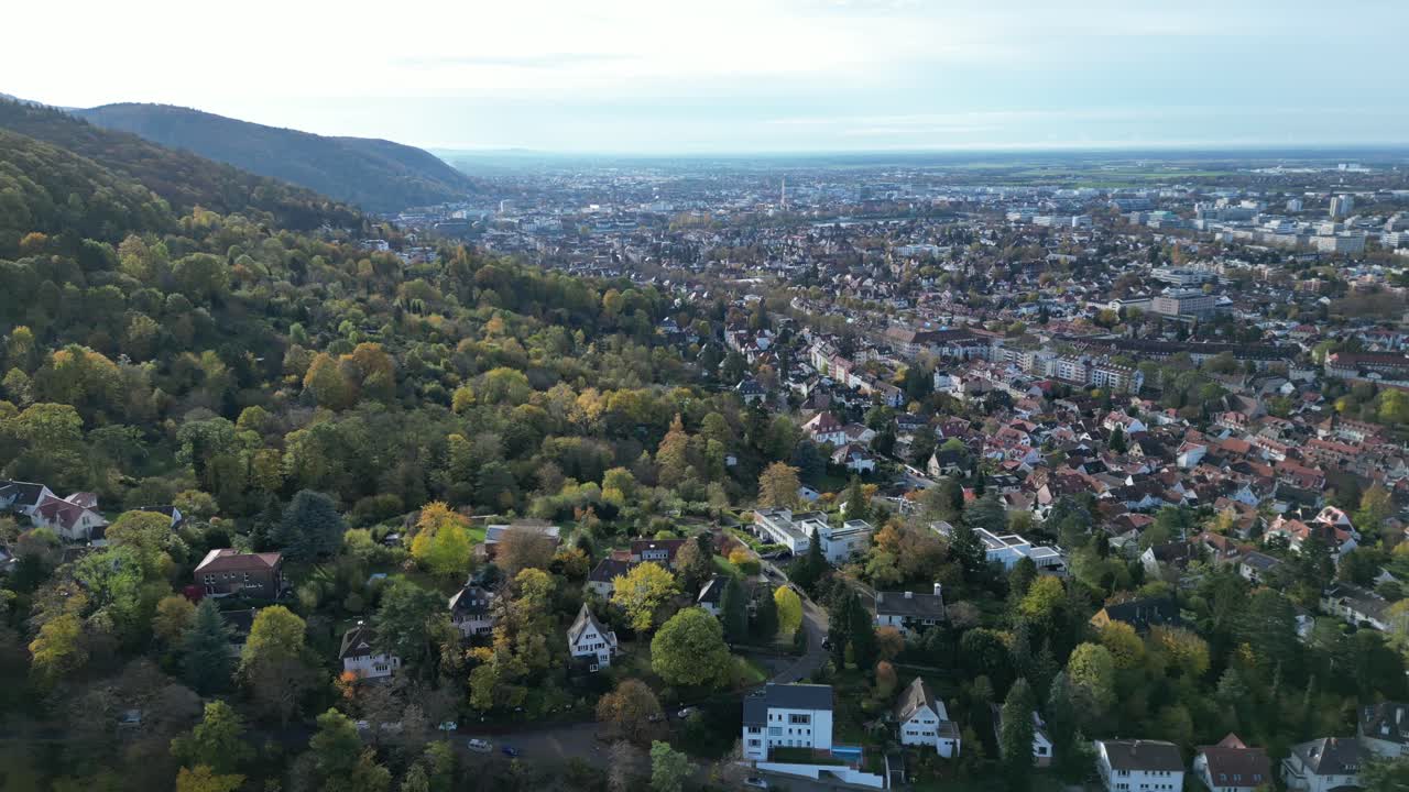 Ascending Drone shot of Heidelberg, drone flying up hill looking towards Heidelberg city centre