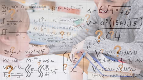 animation of mathematical equations over caucasian schoolkid with smiling teacher in classroom