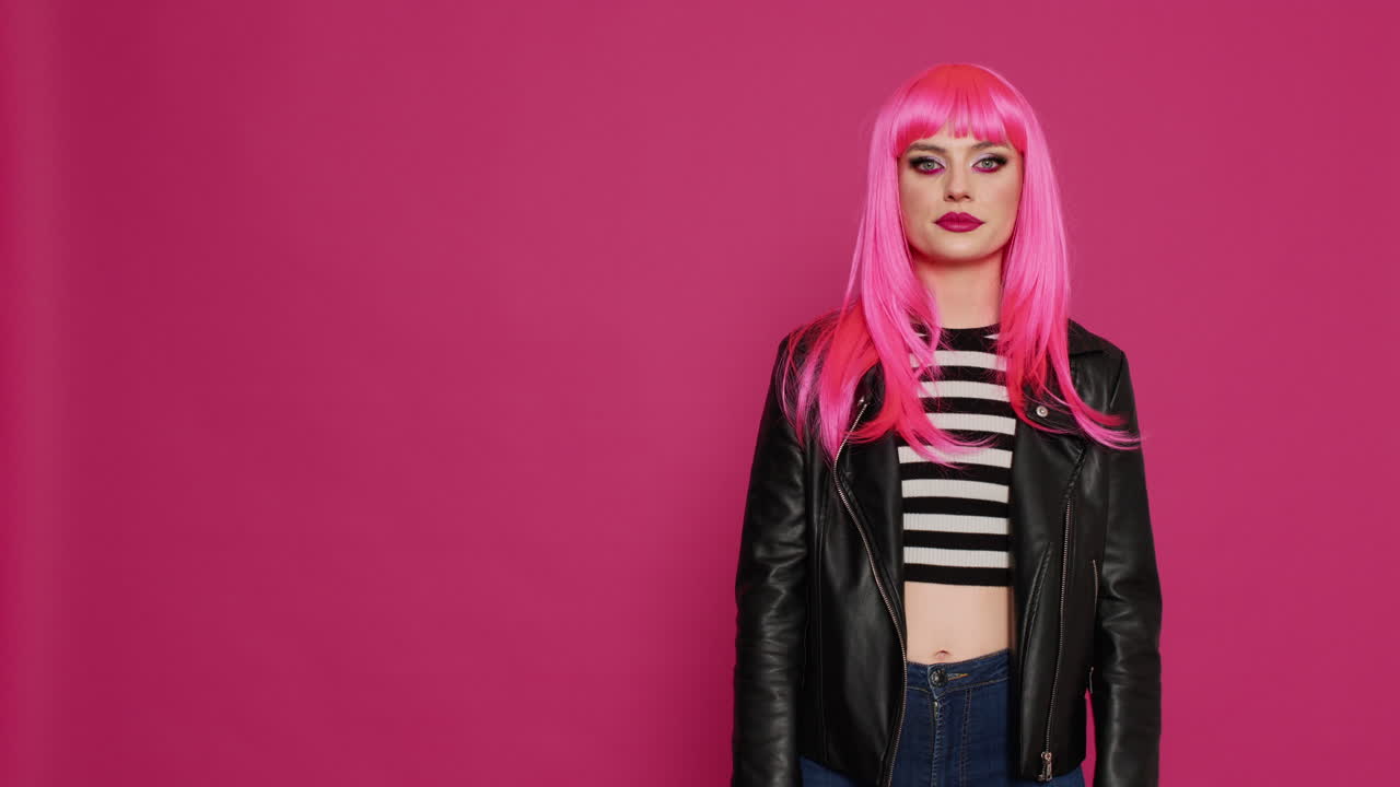 Cheerful confident adult showing heart shaped sign with hands