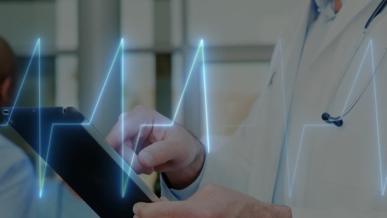 Male doctor holding and tapping tablet in medical clinic room, with ECG waveform graphic overlay