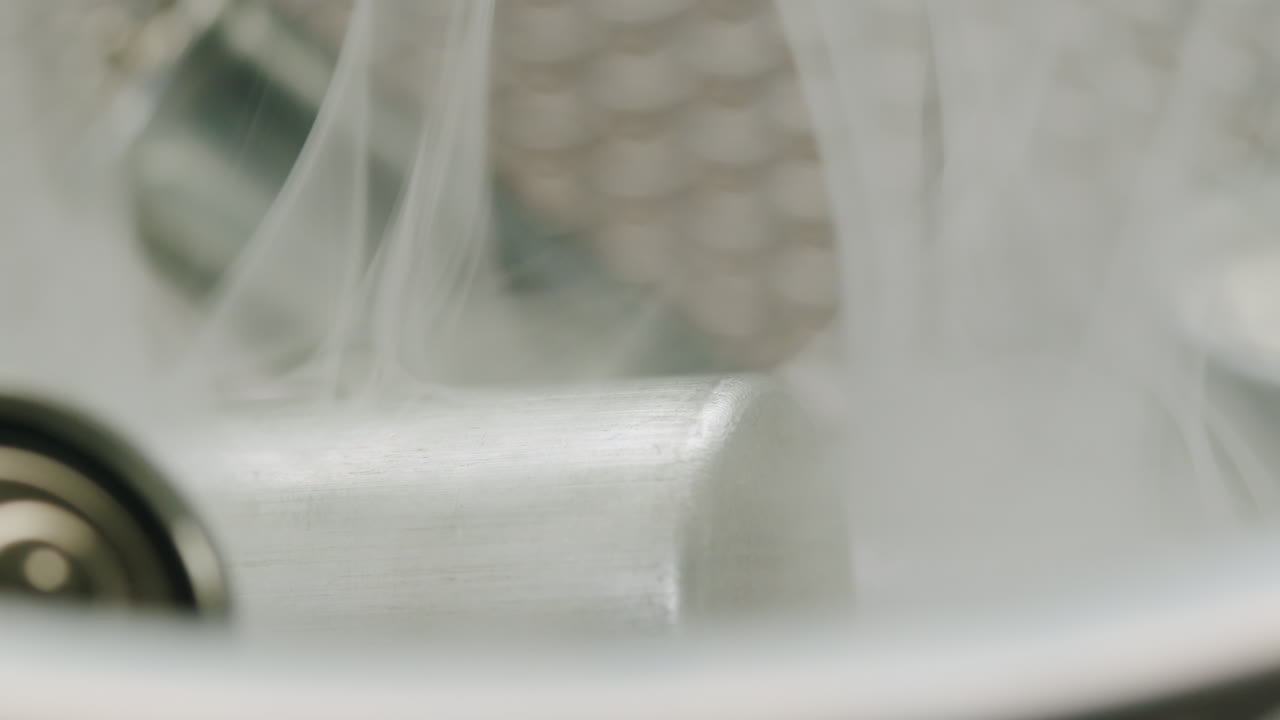 Silver batteries AA and AAA in wastebasket with smoke around close-up. Double-A battery is a standard size single cell cylindrical dry battery. Batteries are common in portable electronic devices. Environmental impacts of lithium-ion batteries concept. An AA battery is composed of a single electroch