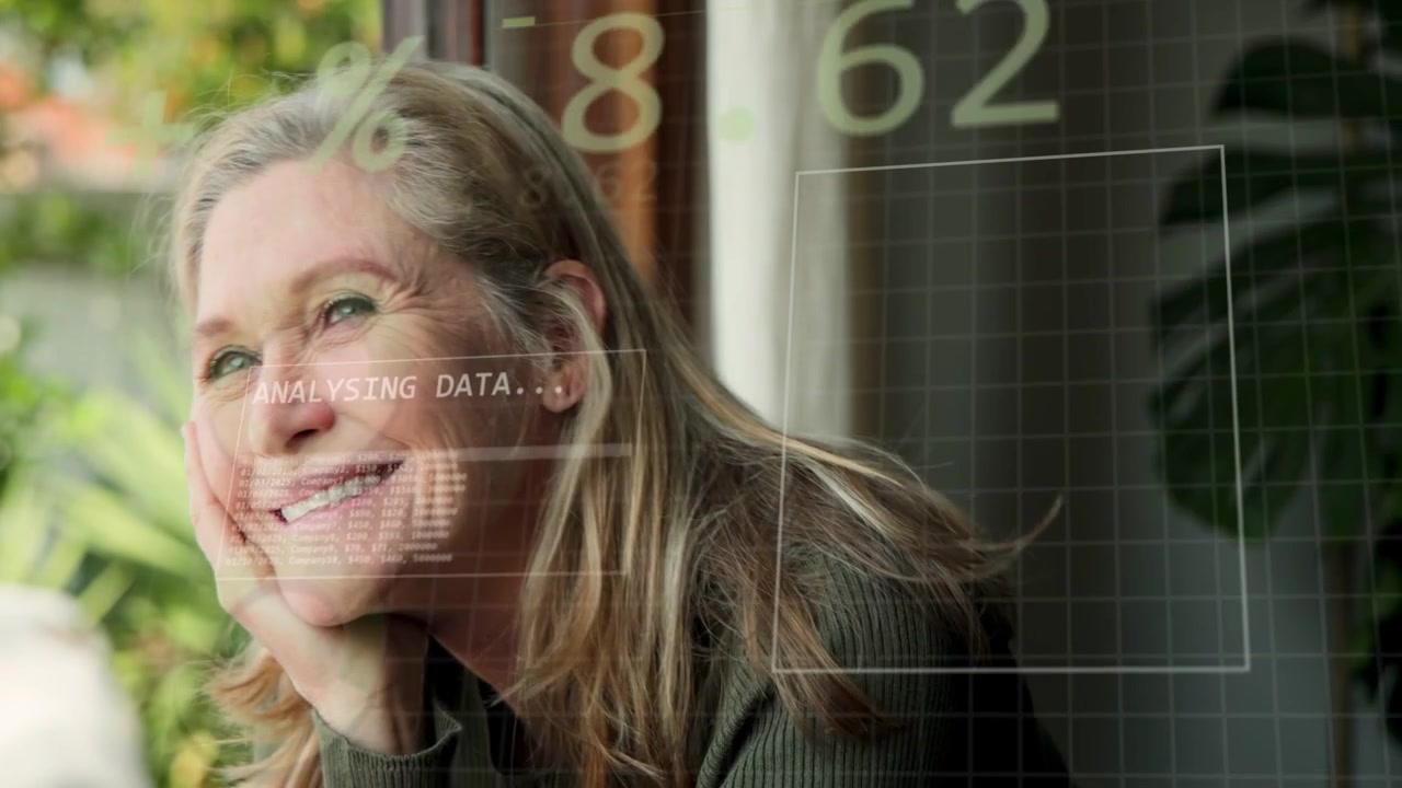Woman resting chin lifting gaze and smiling reacting to HUD analysing data updating numeric grid