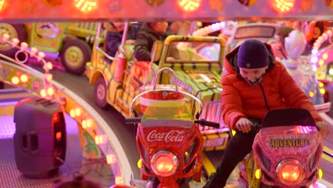 blurred funfair rides with children