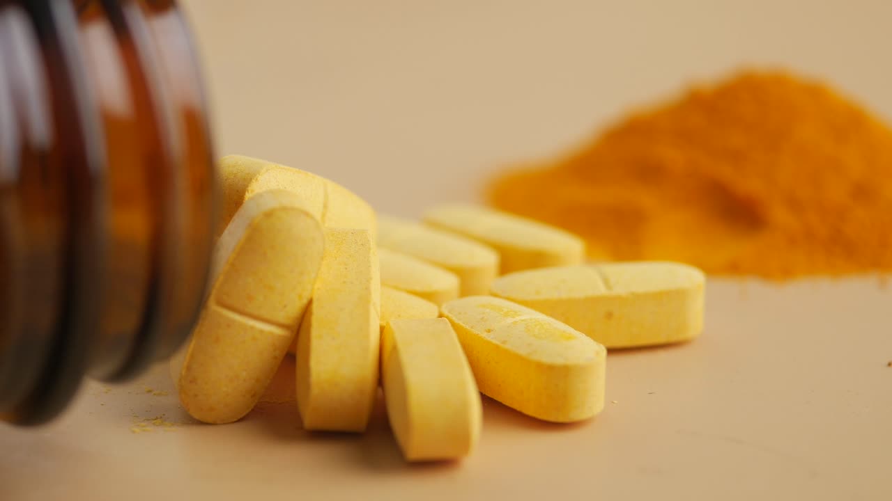 Pills and Turmeric Powder