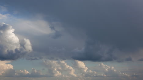 time-lapse | puffy storm clouds dance through the blight blue sky