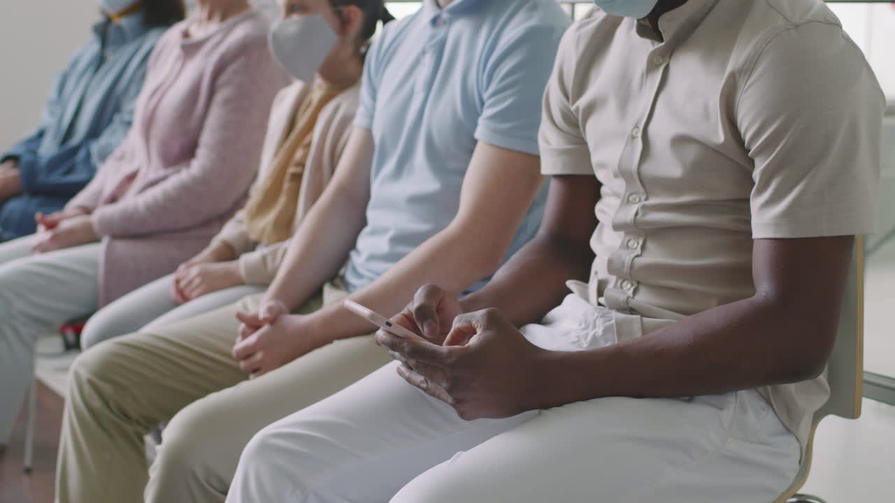 Multiethnic People In Hospital Queue