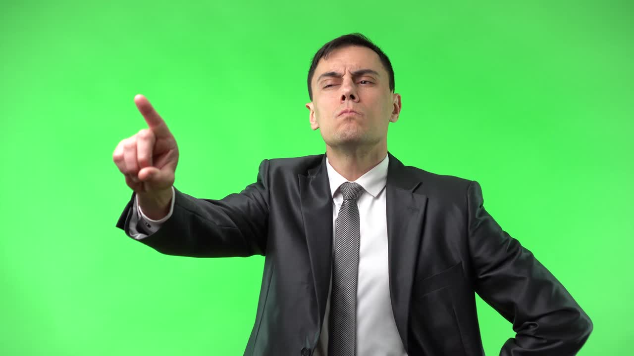 Man in a Suit on Green Screen Pointing and Expressing Various Emotions