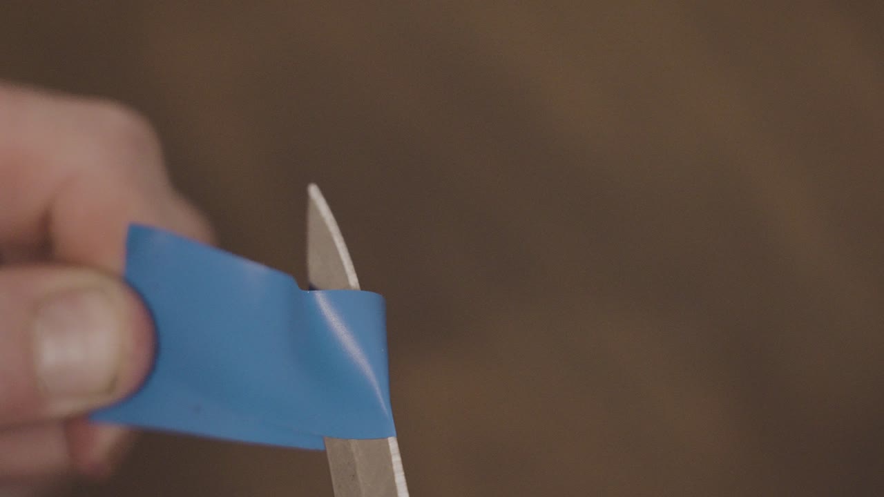 Slowed motion of cutting harsh tape