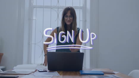 animation of sign up text over caucasian businesswoman using laptop in office