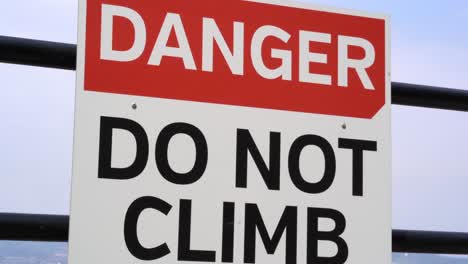 danger sign red and white do not climb