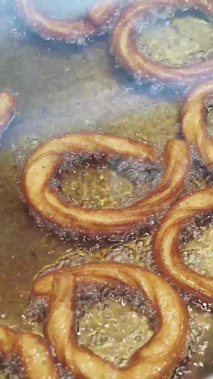 Churros Frying in Hot Oil