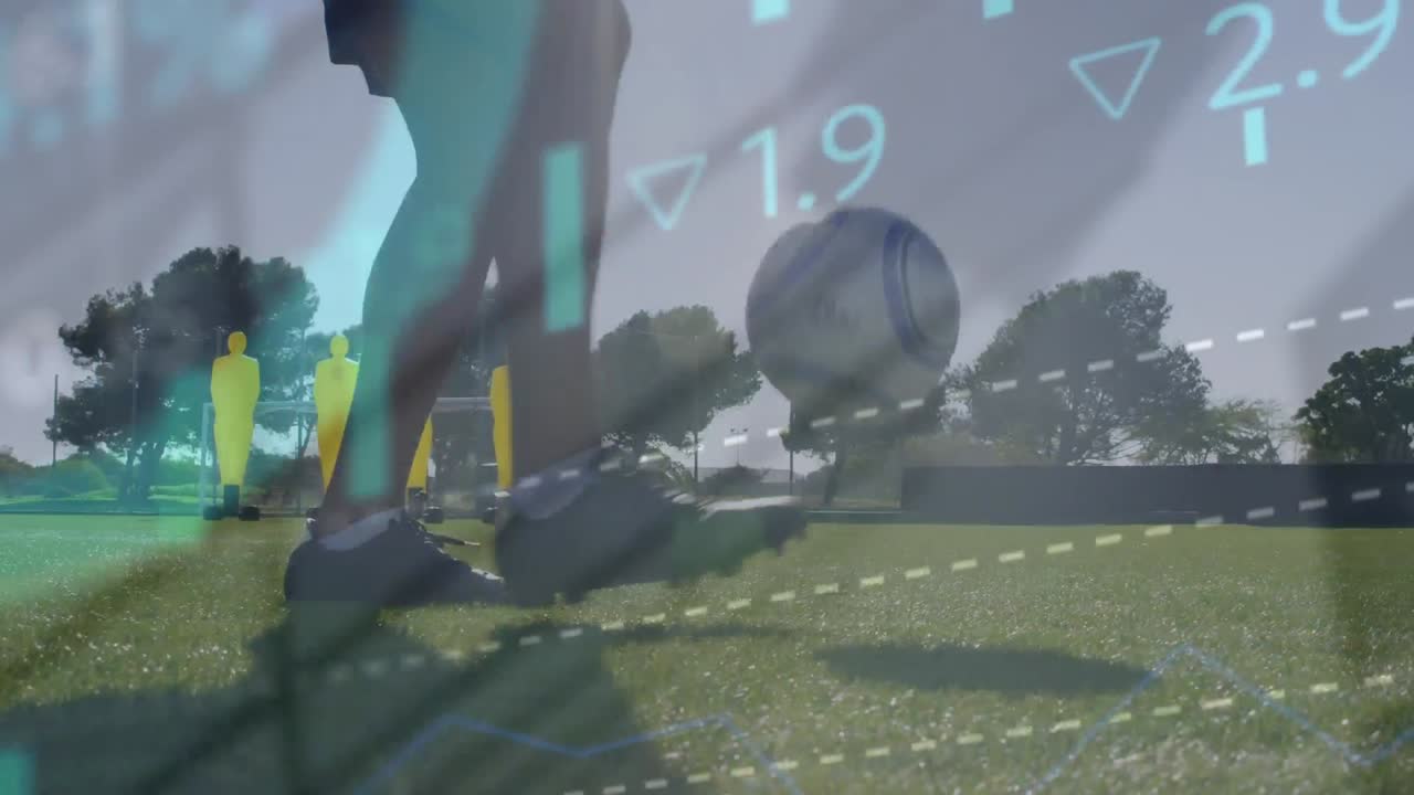 Animation of stock market data processing over mid section of male soccer player juggling a football
