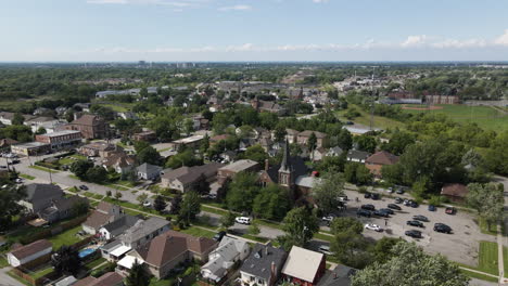 aerial pullback reveals panoramic view of suburban neighborhood lush and green, canada