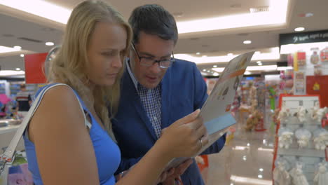 people examining item of goods in the box