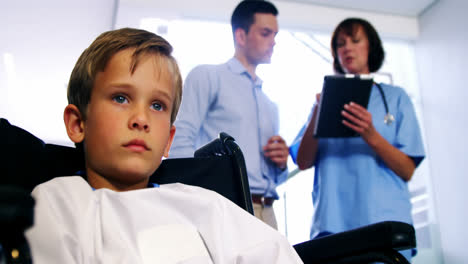 Disable-boy-sitting-on-wheel-chair-at-hospital