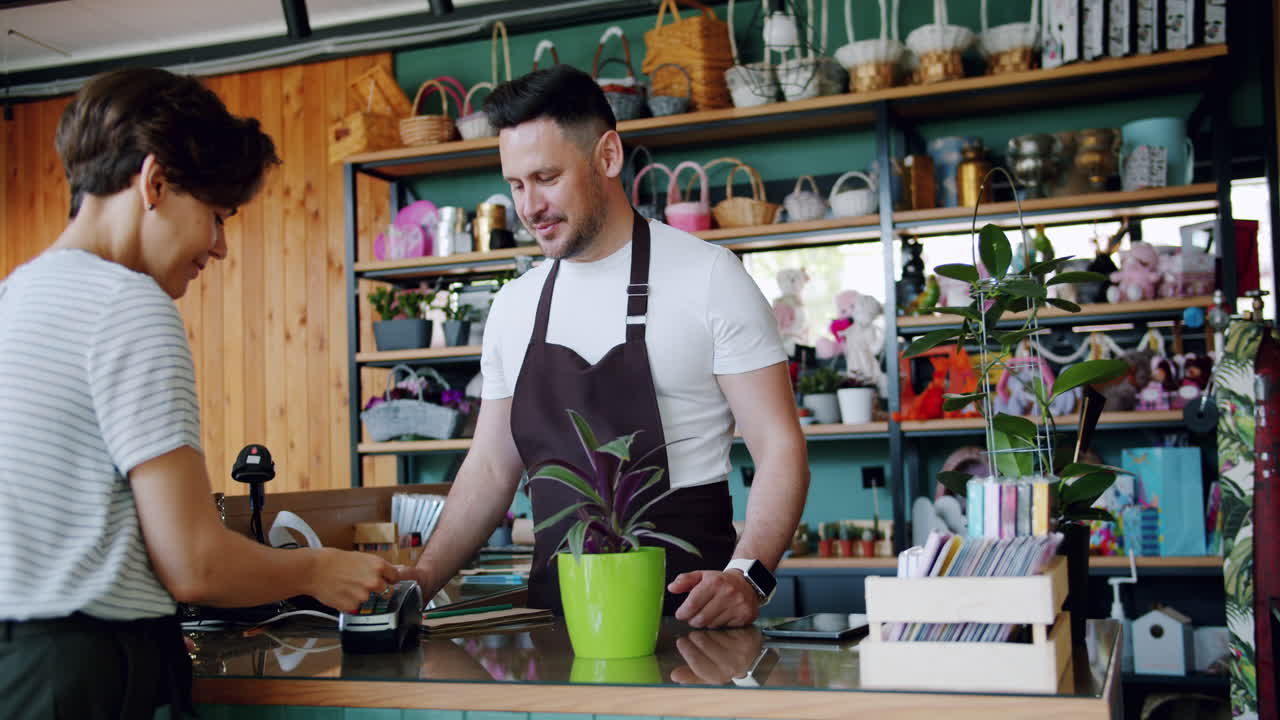 Customer Purchasing a Plant at a Florist Shop